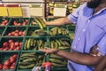 Man is choosing vegetables while doing shopping at the supermarket Royalty Free Stock Photo