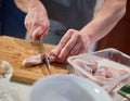 Man chopping chicken wings Royalty Free Stock Photo