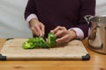 Man chopping green bell pepper