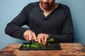 Man chopping herbs Royalty Free Stock Photo