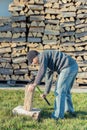 Man chopping a log of wood