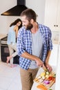 Man chopping vegetables and woman cooking on stove Royalty Free Stock Photo