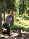 Man chopping wood with an ax Royalty Free Stock Photo