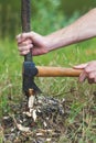 Man is chopping wood with axe. Royalty Free Stock Photo