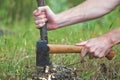 Man is chopping wood with axe Royalty Free Stock Photo