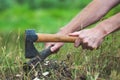 Man is chopping wood with axe. Royalty Free Stock Photo