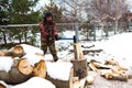 Man chopping wood in the winter Royalty Free Stock Photo