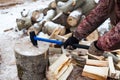 Man chopping wood in the winter Royalty Free Stock Photo