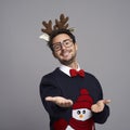 Man in Christmas clothes with palm of hand