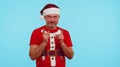 Man in Christmas t-shirt listening music via earphones, dancing disco fooling around having fun Royalty Free Stock Photo
