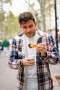 Man with churros with chocolate in street