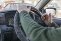 A man driving a car holding a cigarette Royalty Free Stock Photo