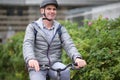 Mature Caucasian man in a bicycle helmet on his bike