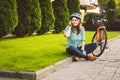 Man and city rolling bicycle, environmentally friendly transport. Beautiful young caucasian woman worker sitting resting on the gr