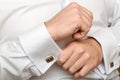 The man clasps a cuff link Royalty Free Stock Photo