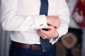 The man clasps cuff links on a shirt Royalty Free Stock Photo