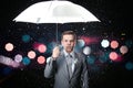 Man in classic suit with white umbrella in flash lights and rain drops Royalty Free Stock Photo