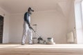 Man clean the parquet with polishing machine