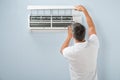 Man cleaning air conditioning system Royalty Free Stock Photo