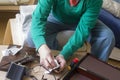 Man cleaning old handgun