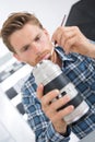 Man cleaning camera lense Royalty Free Stock Photo