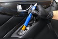 A man cleaning car with microfiber cloth and brush. Car detailing. Valeting concept. Selective focus. Car detailing. Cleaning with Royalty Free Stock Photo