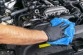 A man cleaning car with microfiber cloth. Car detailing. Valeting concept. Selective focus. Car detailing. Cleaning with sponge. W Royalty Free Stock Photo