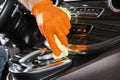 A man cleaning car with microfiber cloth. Car detailing. Selective focus. Car detailing. Cleaning with sponge. Worker cleaning. Mi