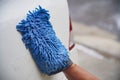 A man cleaning car with microfiber cloth, car detailing or valeting concept Royalty Free Stock Photo