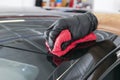 A man cleaning car with microfiber cloth, car detailing or valeting concept. Selective focus. Car detailing. Cleaning with spong Royalty Free Stock Photo