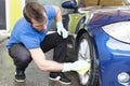 Man cleaning car with sponger. Royalty Free Stock Photo