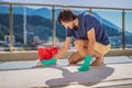 Man cleaning the carpet with foam on the balcony Royalty Free Stock Photo