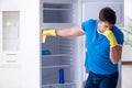 The man cleaning fridge in hygiene concept Royalty Free Stock Photo