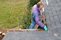 Man cleaning gutters Royalty Free Stock Photo