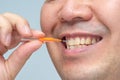 Man cleaning his teeth with an interdental brush Royalty Free Stock Photo