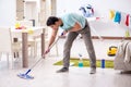 Man cleaning house from mess Royalty Free Stock Photo