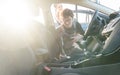 Man cleaning inside of car