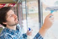 man cleaning inside window pane Royalty Free Stock Photo