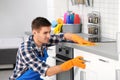 Man cleaning kitchen counter with rag Royalty Free Stock Photo