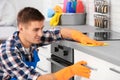 Man cleaning kitchen counter with rag Royalty Free Stock Photo