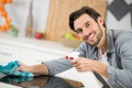 man cleaning kitchen worktop at home Royalty Free Stock Photo