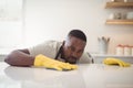 Man cleaning the kitchen worktop Royalty Free Stock Photo