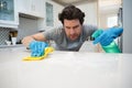 Man cleaning kitchen worktop at home Royalty Free Stock Photo