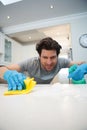 Man cleaning kitchen worktop at home Royalty Free Stock Photo