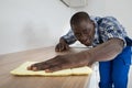 Man Cleaning Kitchen Worktop Royalty Free Stock Photo