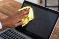 Man Cleaning Laptop Screen With Cloth Royalty Free Stock Photo