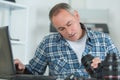 Man cleaning lens digital camera with special brush Royalty Free Stock Photo