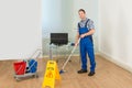 Man cleaning office floor Royalty Free Stock Photo