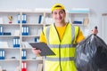 The man cleaning the office and holding garbage bag Royalty Free Stock Photo