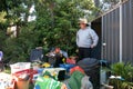 Man cleaning out shed